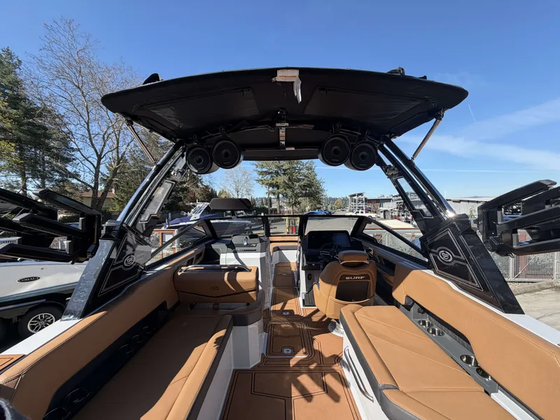 Slide: The Image of Interior view of 2026 Cobalt R8 Surf boat with brown seating. - 10