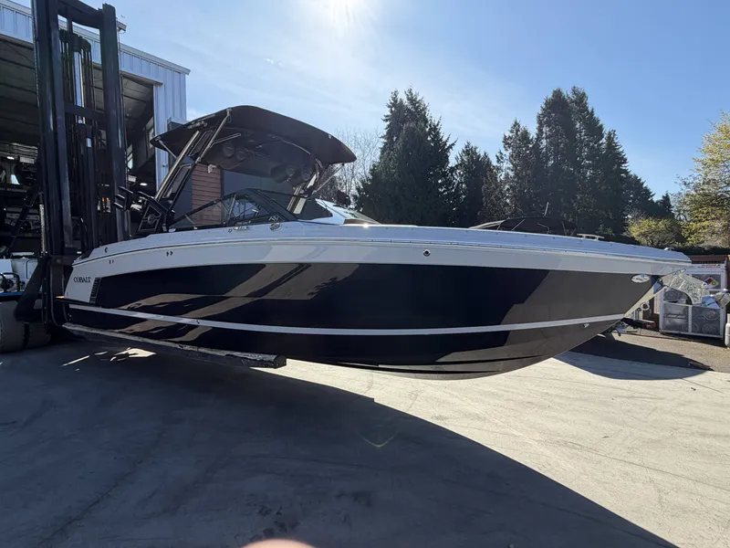 Slide: The Image of 2026 Cobalt R8 Surf boat on a trailer outdoors. - 3