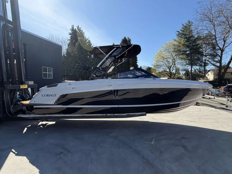 Slide: The Image of 2026 Cobalt R8 Surf boat on a trailer outdoors. - 4