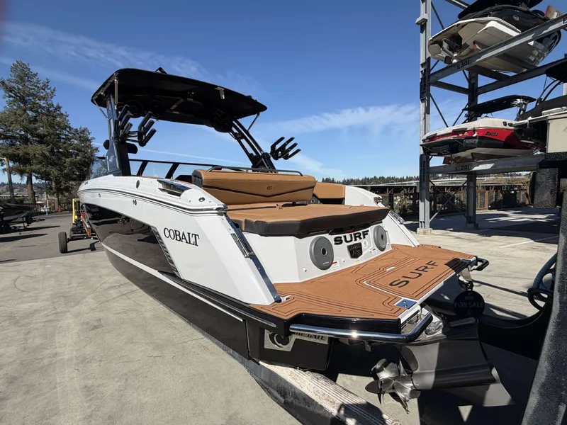 Slide: The Image of 2026 Cobalt R8 Surf boat on a boatyard. - 6