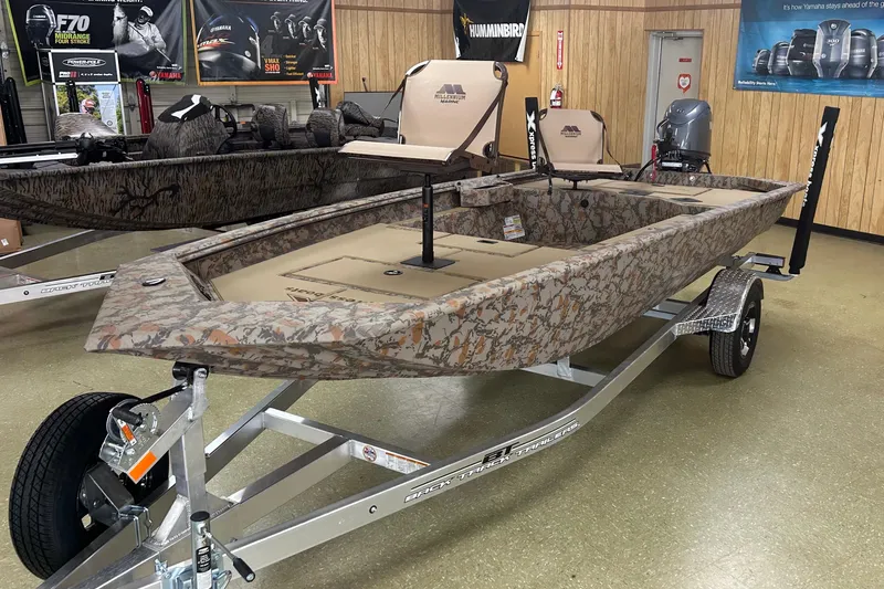 The Image of 2026 Xpress HD16DB boat with camouflage design on display in showroom. - 0