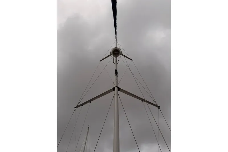Slide: The Image of Mast of 2009 Hunter 38 sailboat against cloudy sky. - 14