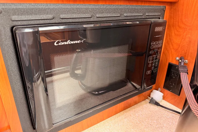Slide: The Image of Built-in Contoure microwave in a 2009 Hunter 38 yacht kitchen. - 26