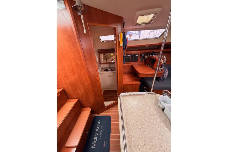 Slide: The Image of Interior of 2009 Hunter 38 sailboat with wood finish and navigation equipment. - 29