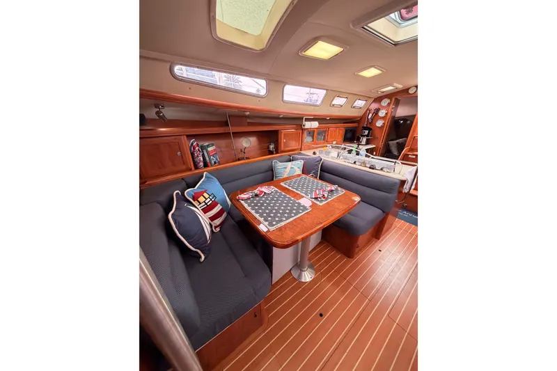 Slide: The Image of Luxurious interior of 2009 Hunter 38 sailboat with cozy seating and elegant wood finishes. - 44