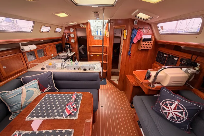 Slide: The Image of Interior of 2009 Hunter 38 sailboat with cozy seating, kitchen, and nautical decor. - 45