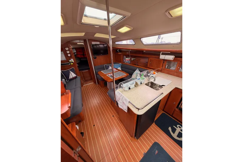 Slide: The Image of Interior of 2009 Hunter 38 sailboat with wood flooring and modern amenities. - 52