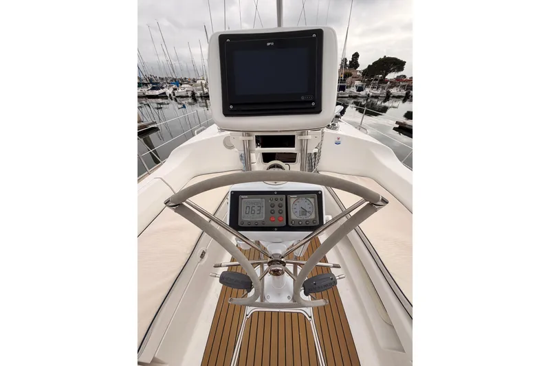 Slide: The Image of Cockpit view of 2009 Hunter 38 sailboat with navigation equipment and steering wheel. - 7