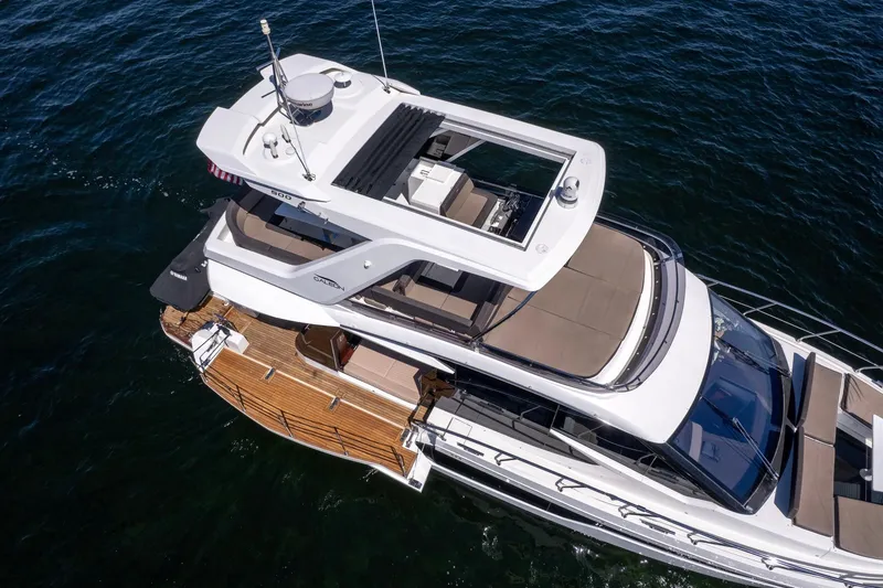 Slide: The Image of 2021 Galeon 500 Fly yacht with spacious deck and modern design on open water. - 11