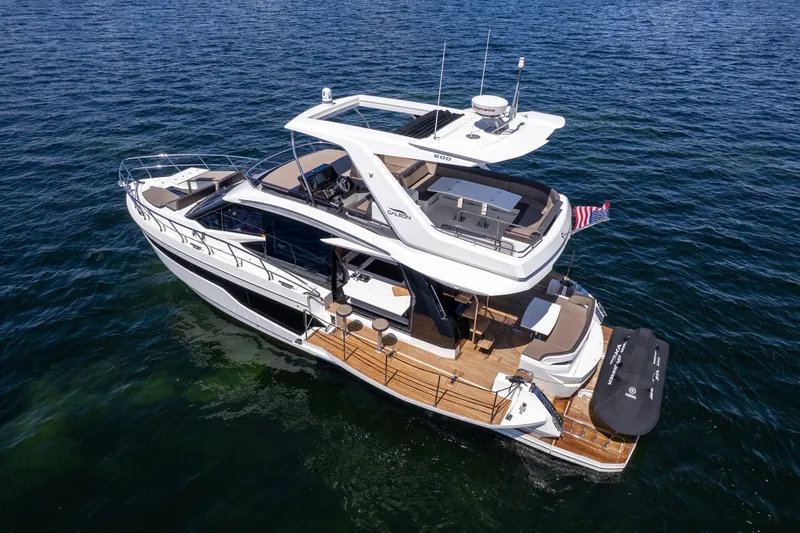 Slide: The Image of 2021 Galeon 500 Fly yacht cruising on open water, showcasing sleek design and luxury features. - 15