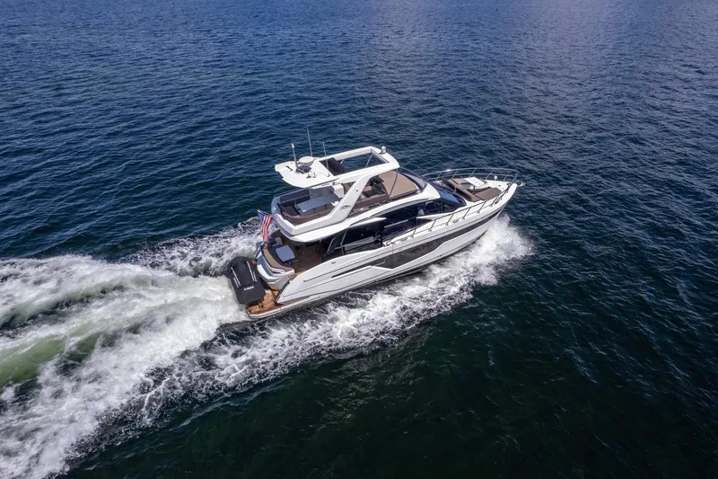 Slide: The Image of 2021 Galeon 500 Fly yacht cruising on open water, aerial view. - 16