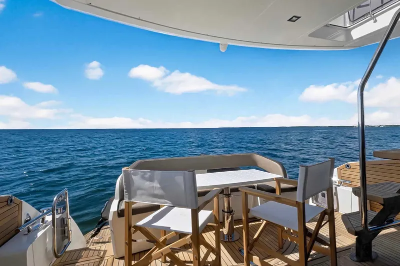 Slide: The Image of 2021 Galeon 500 Fly yacht deck with ocean view and seating area. - 24