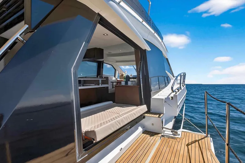 Slide: The Image of 2021 Galeon 500 Fly yacht with open deck, luxurious interior, and ocean view. - 25