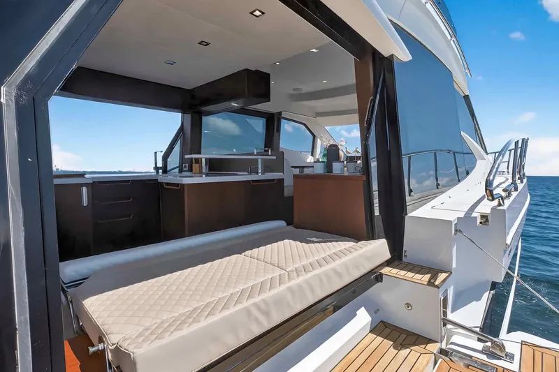 Slide: The Image of Luxurious 2021 Galeon 500 Fly yacht interior with open deck and ocean view. - 26
