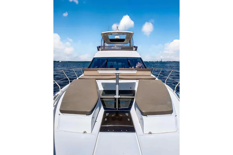 Slide: The Image of 2021 Galeon 500 Fly yacht on open water under blue sky. - 28
