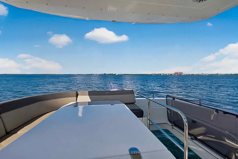 Slide: The Image of Luxurious 2021 Galeon 500 Fly yacht deck with ocean view under clear blue sky. - 35
