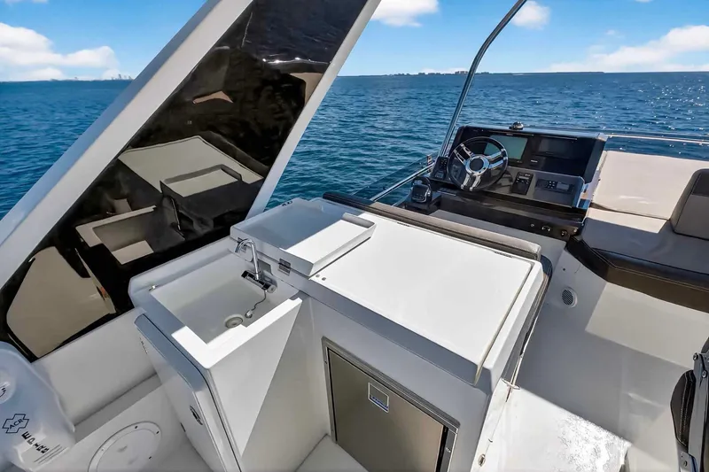 Slide: The Image of 2021 Galeon 500 Fly yacht cockpit with sink and steering wheel, ocean view. - 39