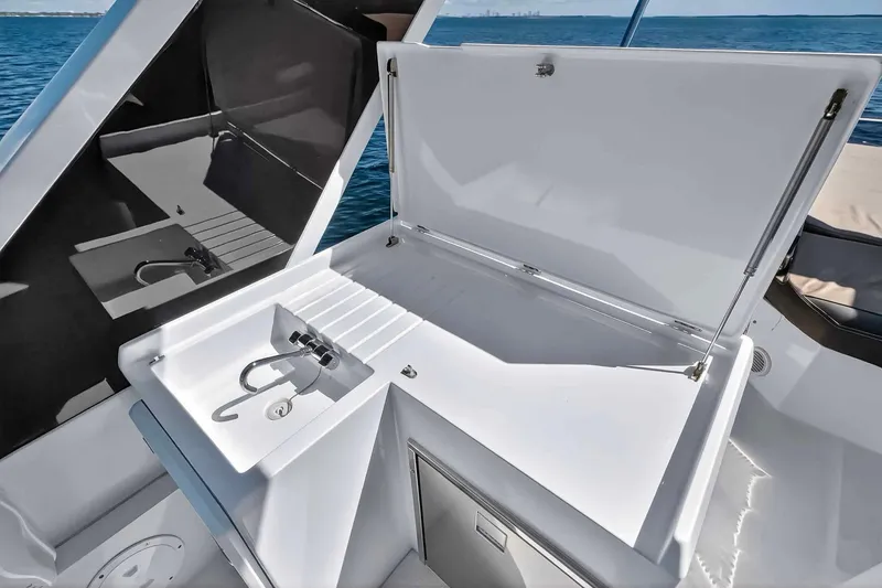 Slide: The Image of Galeon 500 Fly 2021 yacht with open deck storage and sink, ocean view. - 44