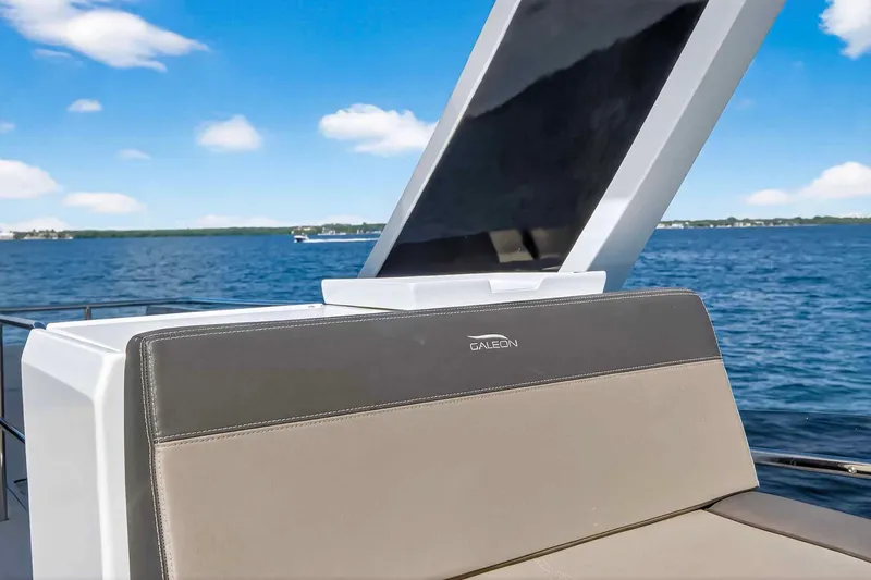 Slide: The Image of Galeon 500 Fly 2021 yacht on open water, featuring sleek design and comfortable seating. - 45