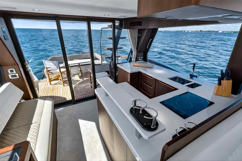 Slide: The Image of Luxurious interior of 2021 Galeon 500 Fly yacht with modern kitchen and ocean view. - 59