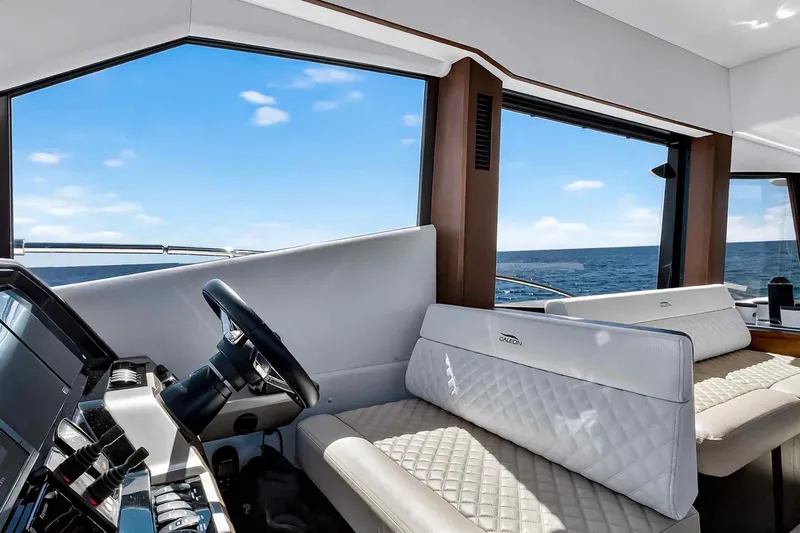 Slide: The Image of Interior of 2021 Galeon 500 Fly yacht with luxurious seating and ocean view. - 63