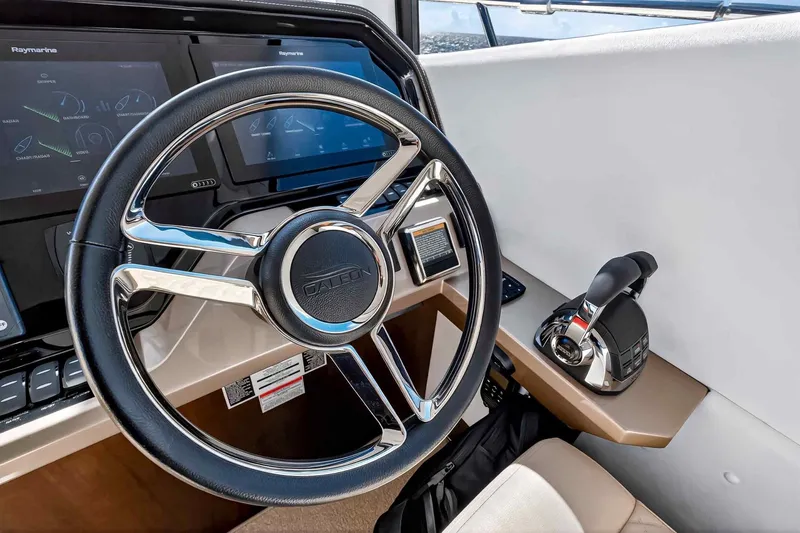 Slide: The Image of Helm of 2021 Galeon 500 Fly yacht with modern controls and steering wheel. - 67