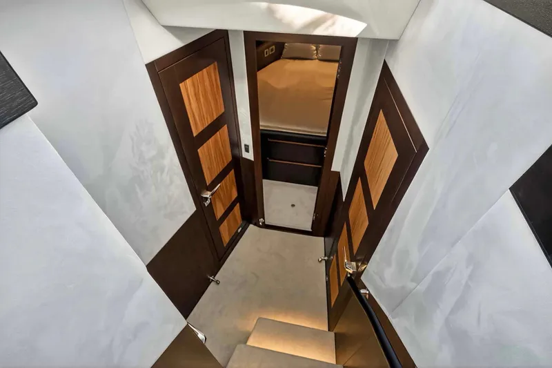 Slide: The Image of Interior view of 2021 Galeon 500 Fly yacht, featuring elegant wooden doors and modern design. - 68