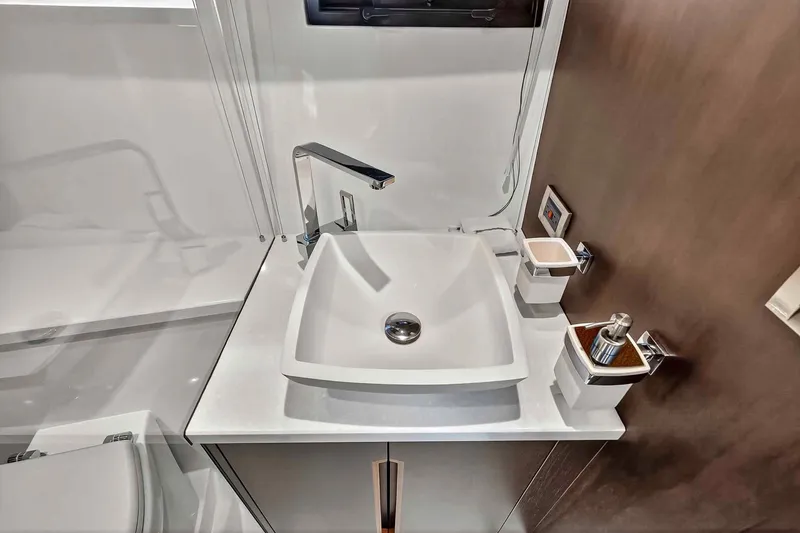 Slide: The Image of Modern bathroom sink in 2021 Galeon 500 Fly yacht, featuring sleek design and fixtures. - 75