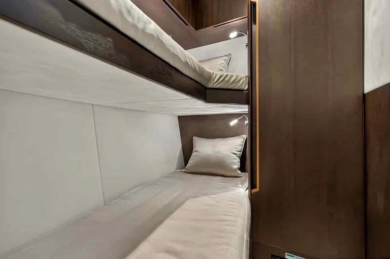 Slide: The Image of 2021 Galeon 500 Fly yacht interior with cozy bunk beds and modern lighting. - 76