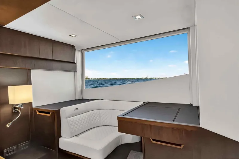Slide: The Image of Luxurious interior of 2021 Galeon 500 Fly yacht with ocean view through large window. - 81