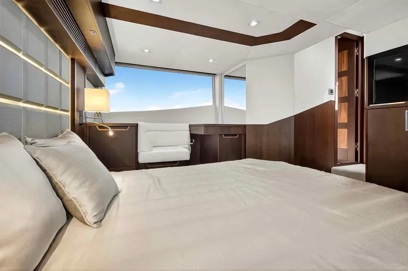 Slide: The Image of Luxurious bedroom interior of 2021 Galeon 500 Fly yacht with modern design and large windows. - 86