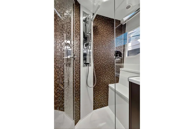 Slide: The Image of Luxurious shower in 2021 Galeon 500 Fly yacht with mosaic tiles and modern fixtures. - 93