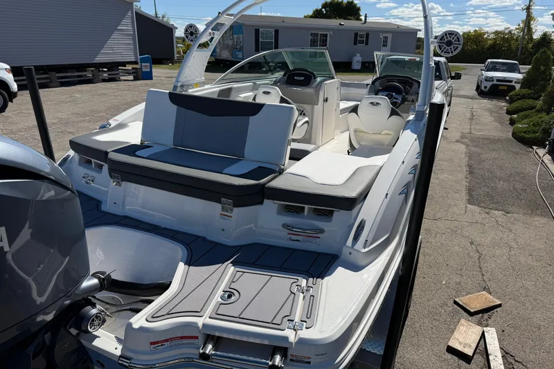 Slide: The Image of 2024 Chaparral 23 SSi OB boat with sleek design and spacious seating. - 19