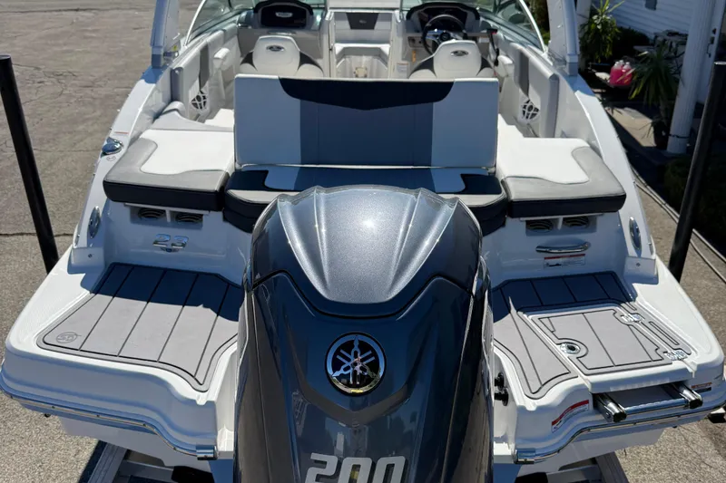 Slide: The Image of 2024 Chaparral 23 SSi OB boat with Yamaha outboard motor, featuring spacious seating. - 21