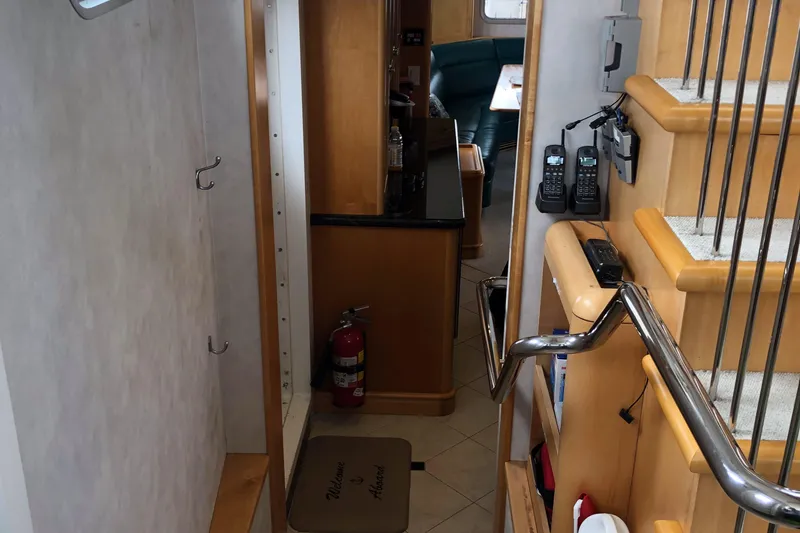 Slide: The Image of Interior of 2003 Cape Horn Trawler with stairs, fire extinguisher, and communication devices. - 10