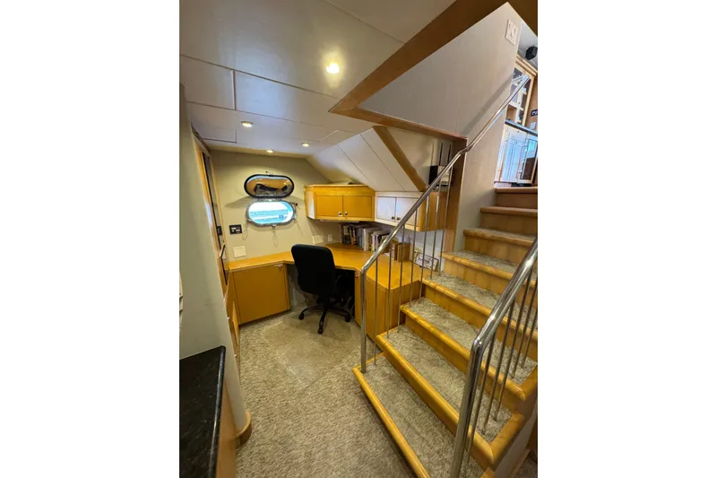 Slide: The Image of Interior of 2003 Cape Horn Trawler with desk, chair, and staircase. - 27