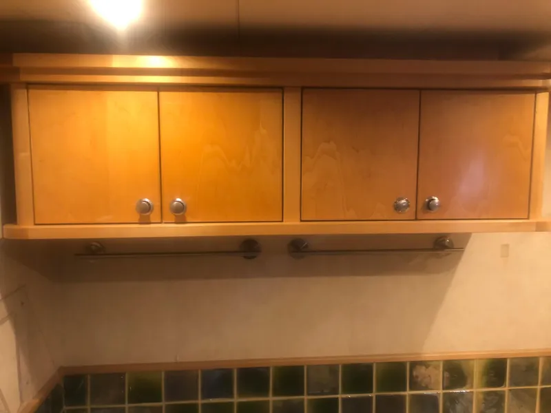 Slide: The Image of Wooden cabinets in a 2003 Cape Horn Trawler kitchen interior. - 33