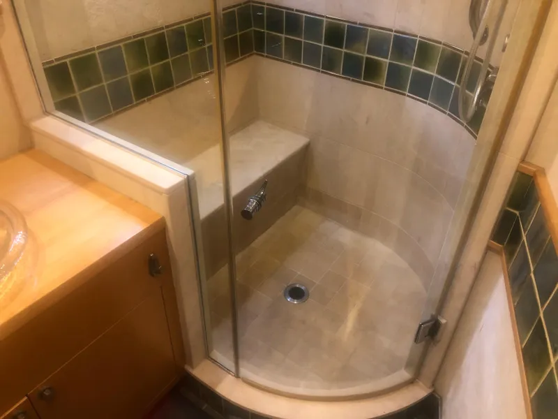 Slide: The Image of Shower area in 2003 Cape Horn Trawler with glass door and tiled walls. - 35