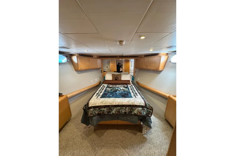 Slide: The Image of Cozy cabin interior of 2003 Cape Horn Trawler with bed and wooden cabinetry. - 37