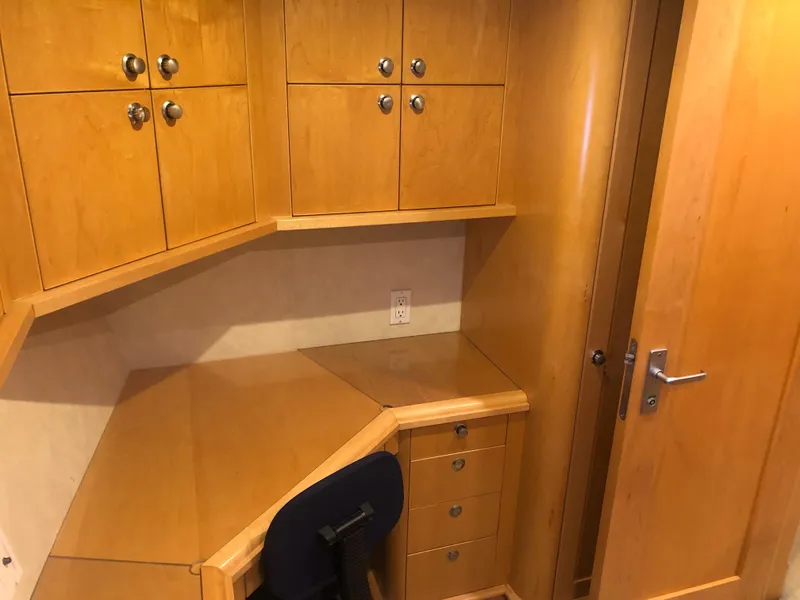 Slide: The Image of 2003 Cape Horn Trawler interior with wooden desk and cabinets. - 41