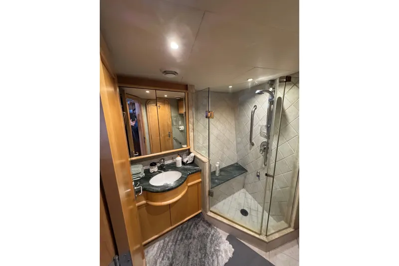 Slide: The Image of Luxurious bathroom in 2003 Cape Horn Trawler with glass shower and elegant vanity. - 42