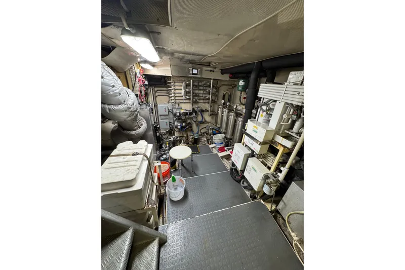 Slide: The Image of Engine room of a 2003 Cape Horn Trawler, featuring machinery and equipment. - 47