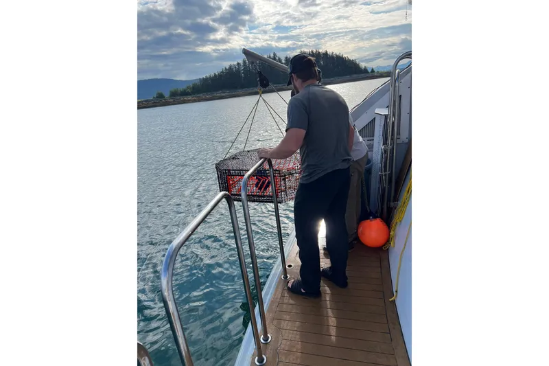 Slide: The Image of Man on 2003 Cape Horn Trawler fishing with trap in scenic waters. - 55