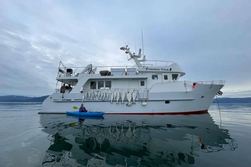 Slide: The Image of 2003 Cape Horn Trawler "Evening Star" with kayaker on calm water. - 57