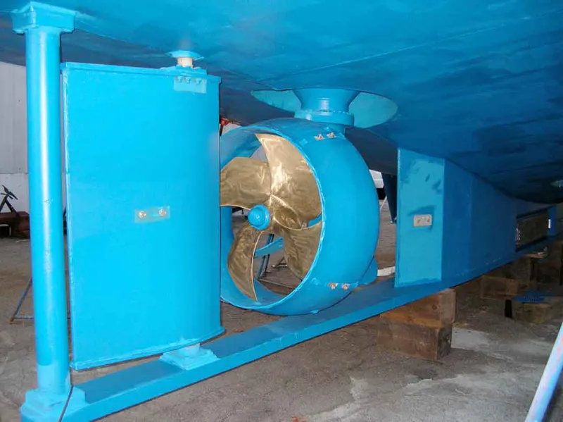 Slide: The Image of 2003 Cape Horn Trawler propeller and hull, painted blue, in a dry dock setting. - 62