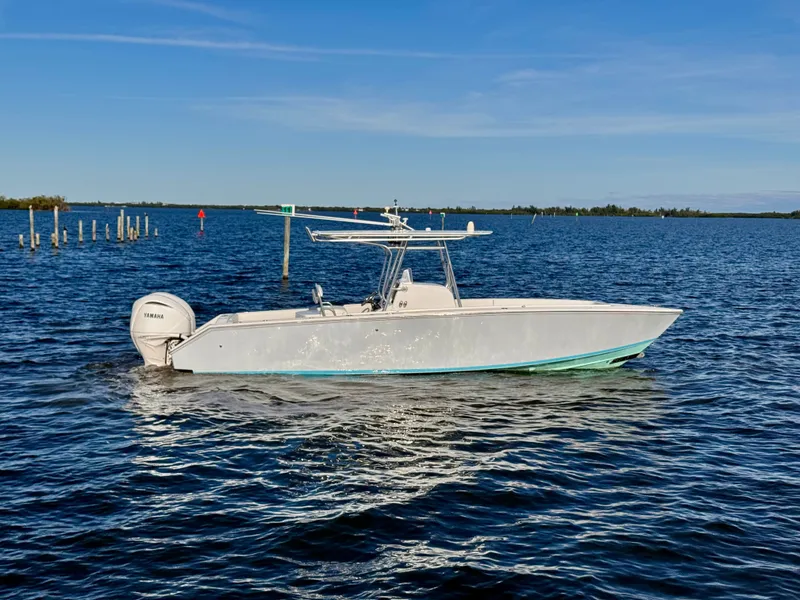 The Image of 2008 Jupiter 30 boat cruising on a calm blue sea under a clear sky. - 0