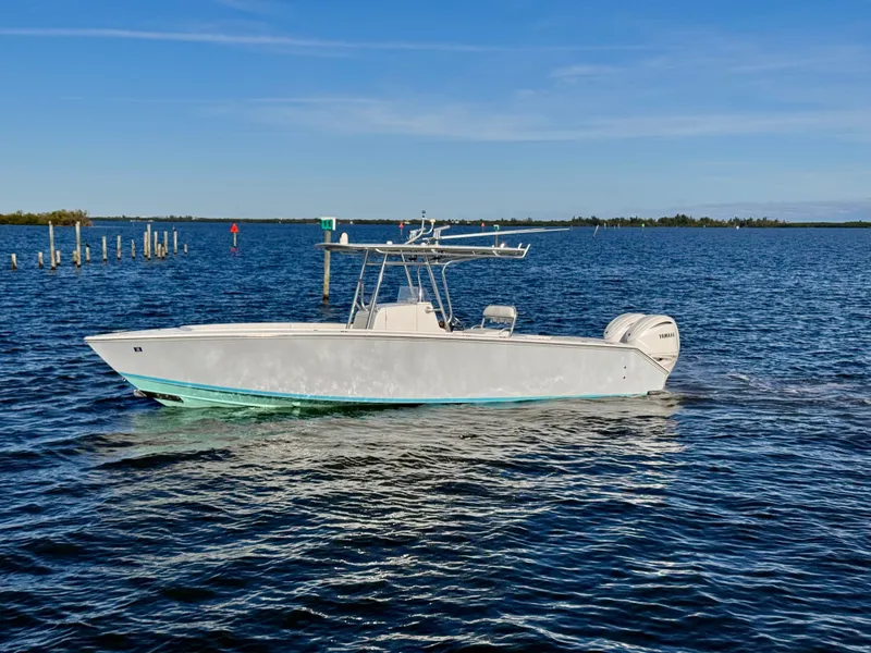 Slide: The Image of 2008 Jupiter 30 boat cruising on calm blue waters under clear skies. - 10