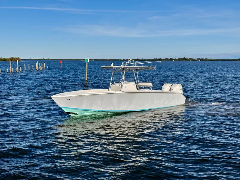 Slide: The Image of A 2008 Jupiter 30 boat cruising on a calm, sunny day. - 11