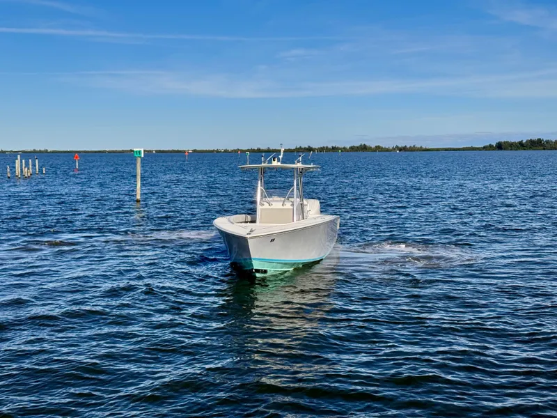 Slide: The Image of A 2008 Jupiter 30 boat cruising on a calm, sunny day. - 14