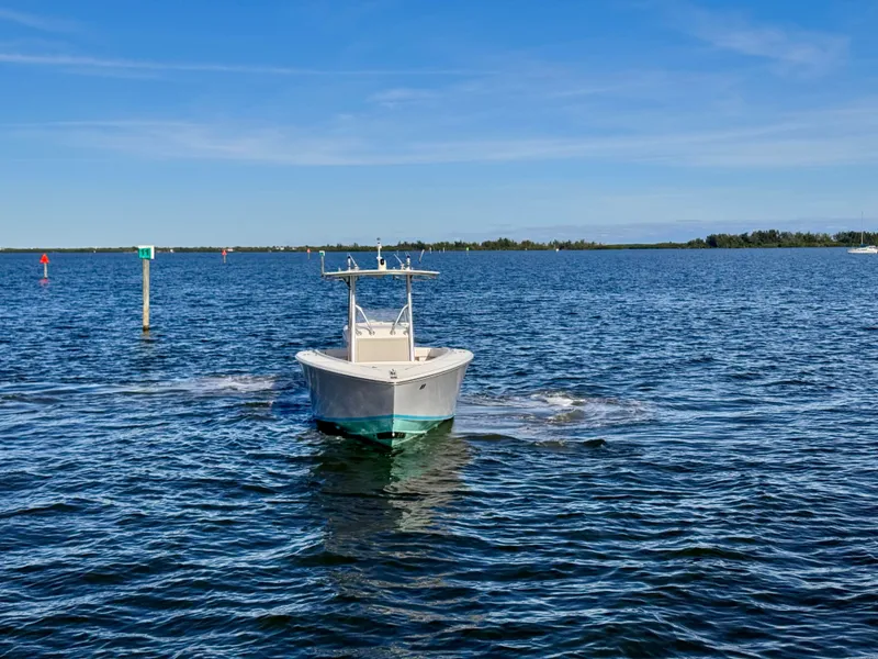 Slide: The Image of A 2008 Jupiter 30 boat navigating calm blue waters under a clear sky. - 15